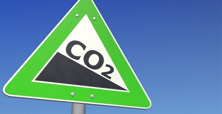 Znak drogowy symbolicznie nakazujący obniżanie CO2